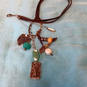 8-24 Plunder necklace leather strap says do small things with great love